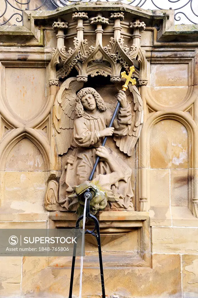 High-relief of St. Michael and the Dragon as a well figure on the Gothic Fischbrunnen fountain, built in 1509 by the Haller sculptor Hans Beuscher, Ma...