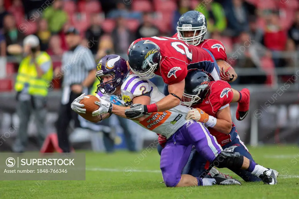 American football, RB Dusty Thornhill, No. 2 Vikings, is tackled by LB Andrew Preston, No. 22 Broncos, Vienna Vikings vs. Calanda Broncos, final game ...