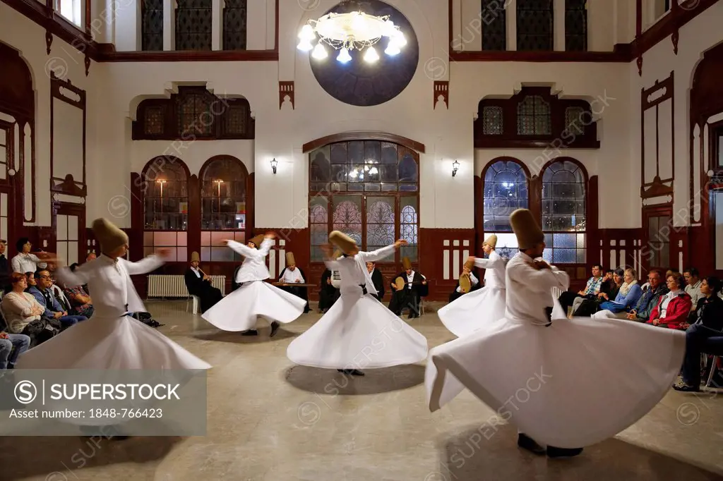 Whirling Dervishes dancing the Sema, a Dervish dance, Sirkeci Railway Station, Istanbul, Turkey, Europe