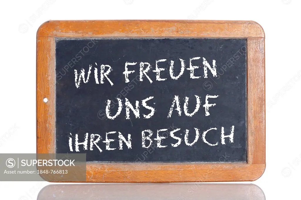 Old school blackboard with the words WIR FREUEN UNS AUF IHREN BESUCH, German for We are looking forward to your visit