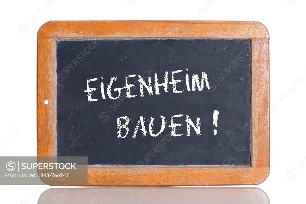 Old chalkboard, lettering EIGENHEIM BAUEN, German for BUILD A HOUSE