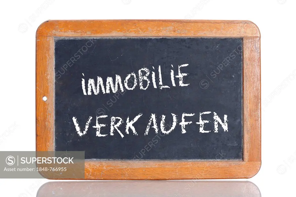 Old chalkboard, lettering IMMOBILIE VERKAUFEN, German for SELL A PROPERTY