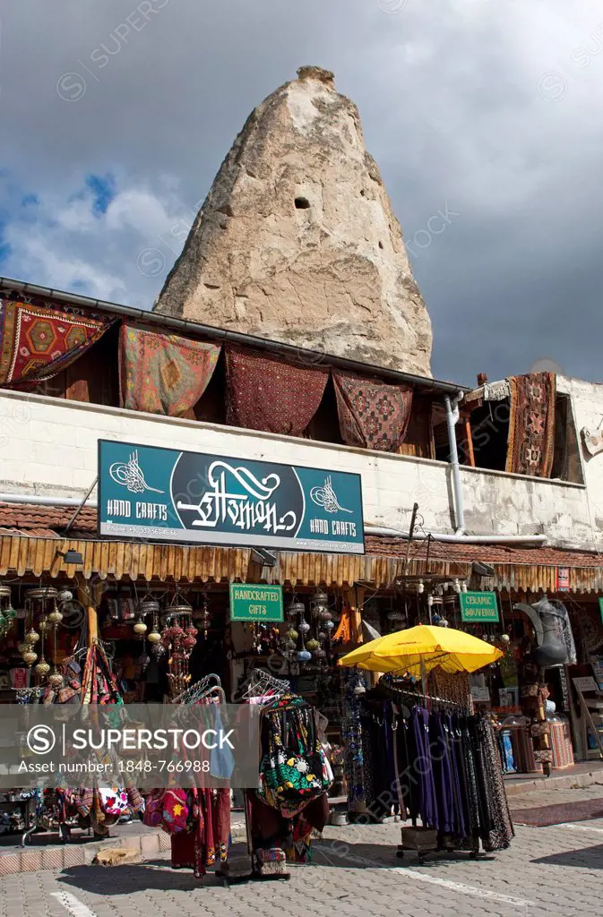 Souvenir shops on the market square, a tuff cone at the back