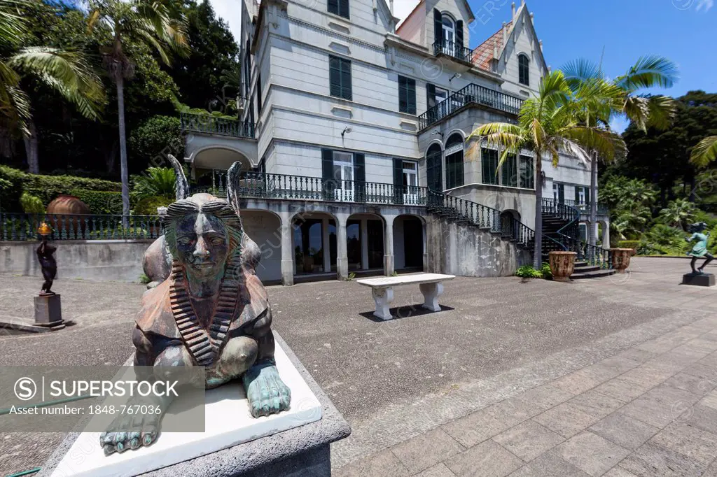 Sphinx sculpture in front of the palace, Jardim Botnico da Madeira or Botanical Garden, on the grounds of the farm of the Reid hotelier family, Jose ...