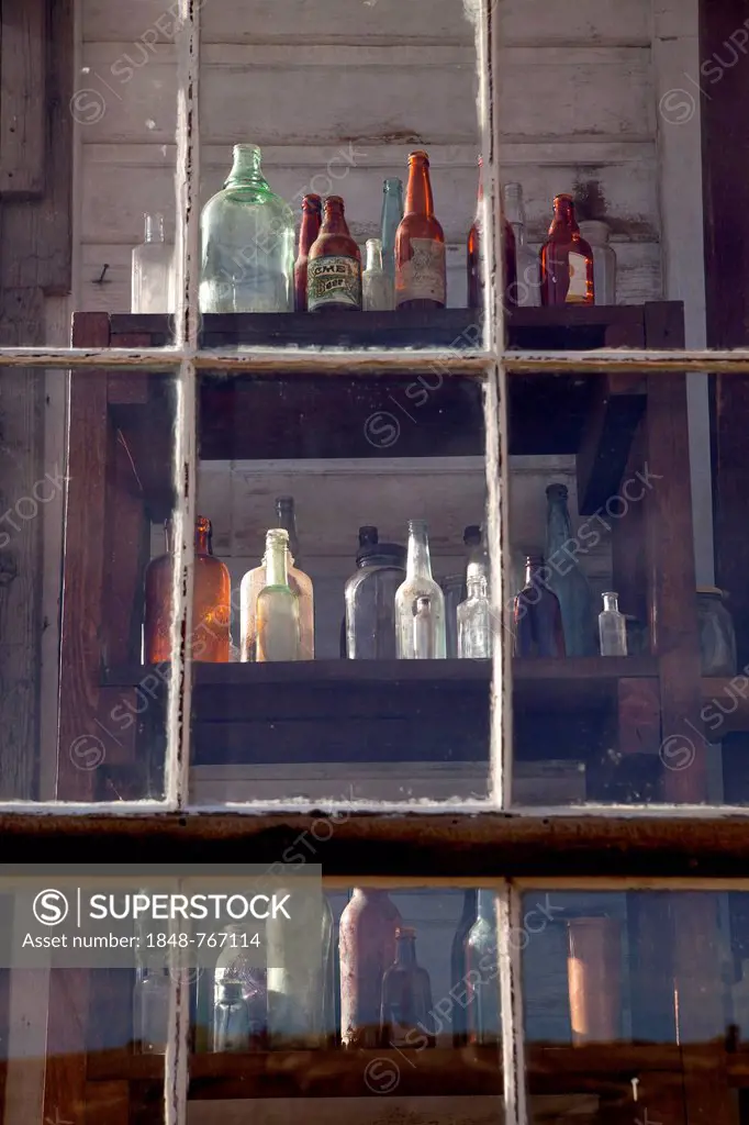 Old bottles in a window, ghost town of Bodie