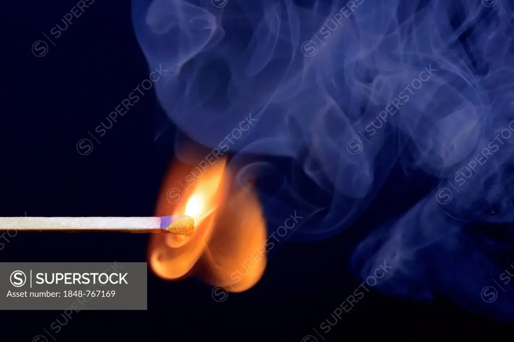Match being lit, blue smoke