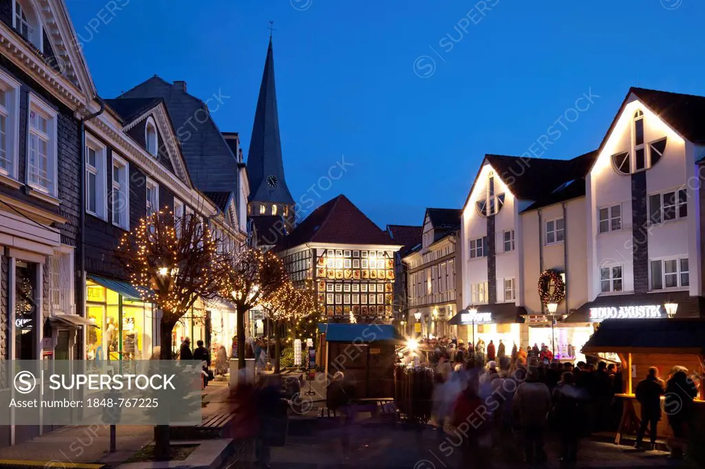 Christmas market at the old town hall with St. George's Church at back, historic old town at night
