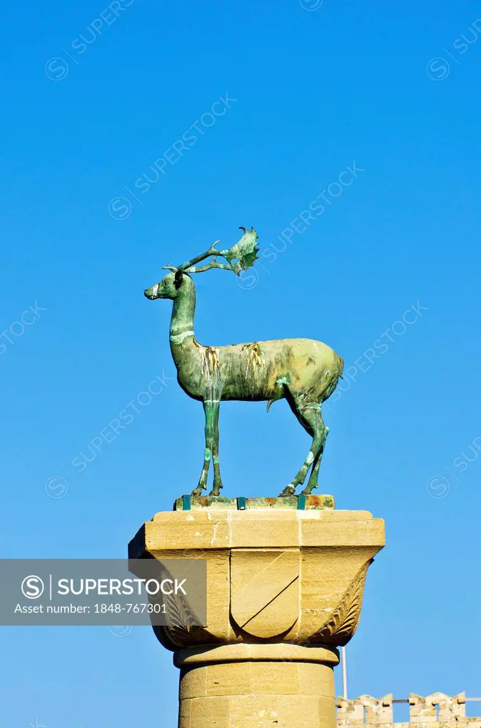 Elafos, sculpture of a deer on a column at the harbour entrance of Rhodes, Mandraki harbour