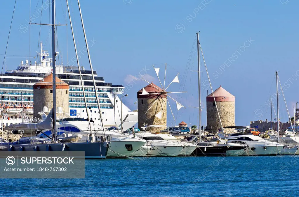 Harbour entrance of Rhodes in front of a cruise ship
