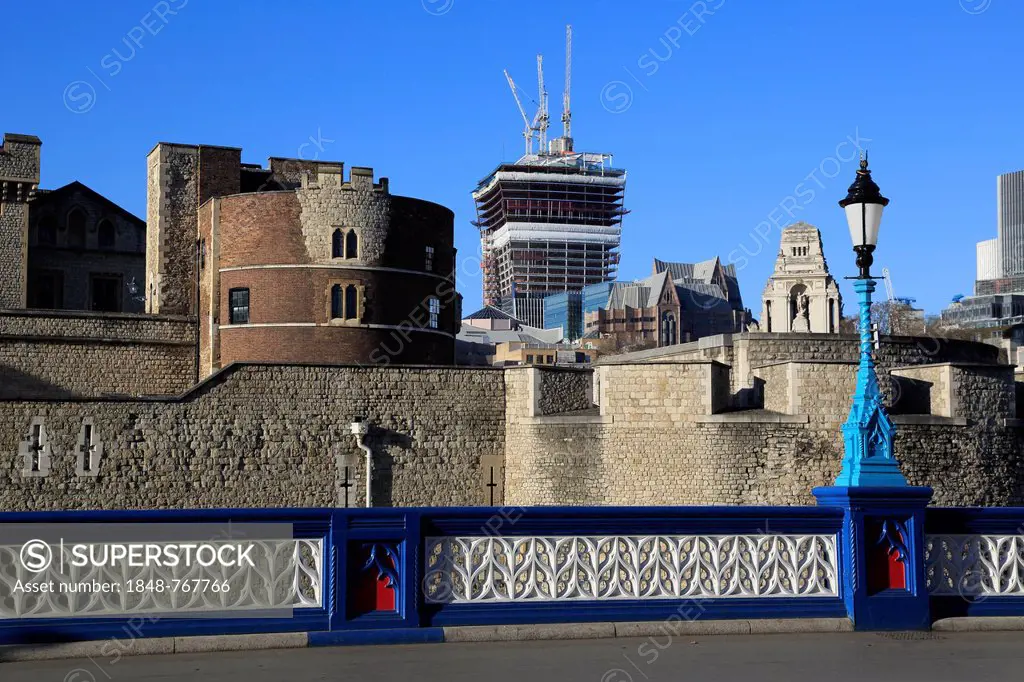 The Tower of London, seen from the approach of the Tower Bridge, looking towards the Port of London Authority Building and the construction site of th...