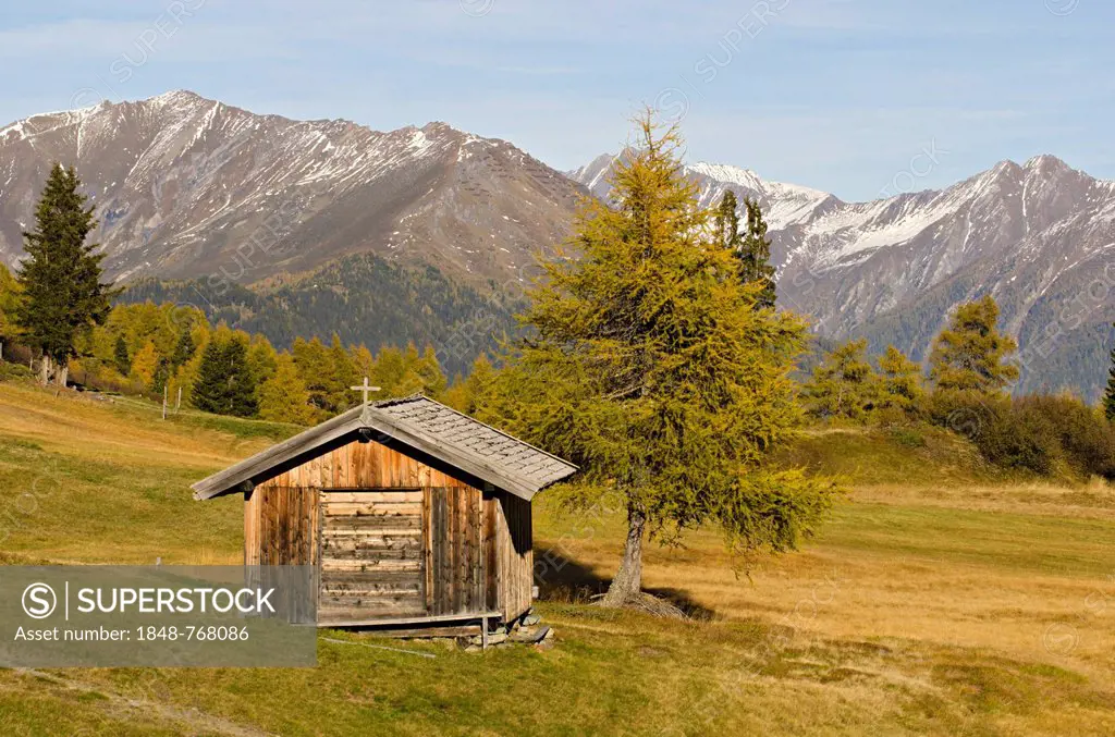 Hay barn in Obernbergtal valley in front of the Tux Alps