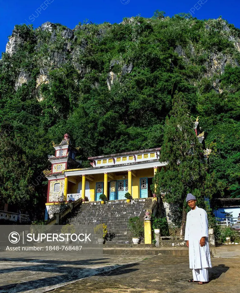 Monk in front of An Quang Pagoda in the Marble Mountains