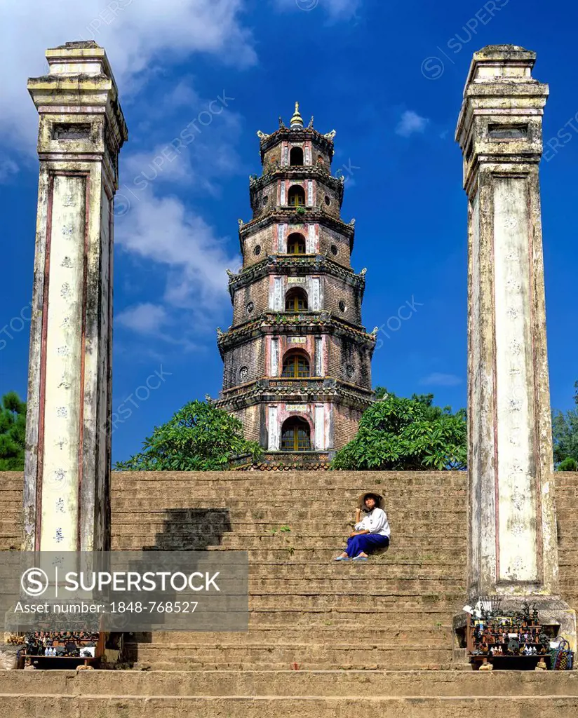 Thien Mu Pagoda, Heavenly Lady Pagoda, seven-storey Phuoc Duyen Tower, woman sitting on the stairs