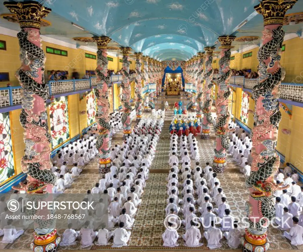 Cao Dai Temple, interior during a mass with worshippers, Caodaiism