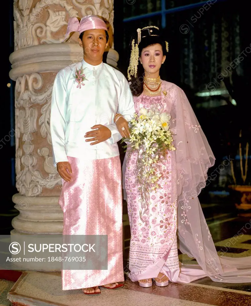 Married couple wearing traditional costume, wedding