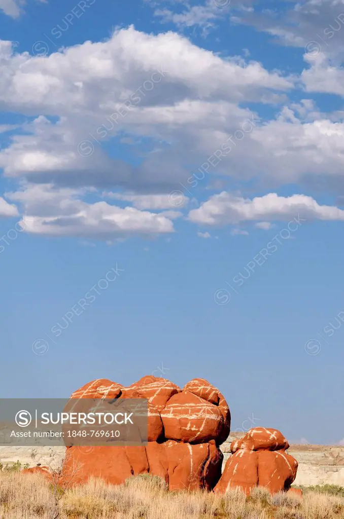 Sandstone boulders, sandstone formations, with cumulus clouds