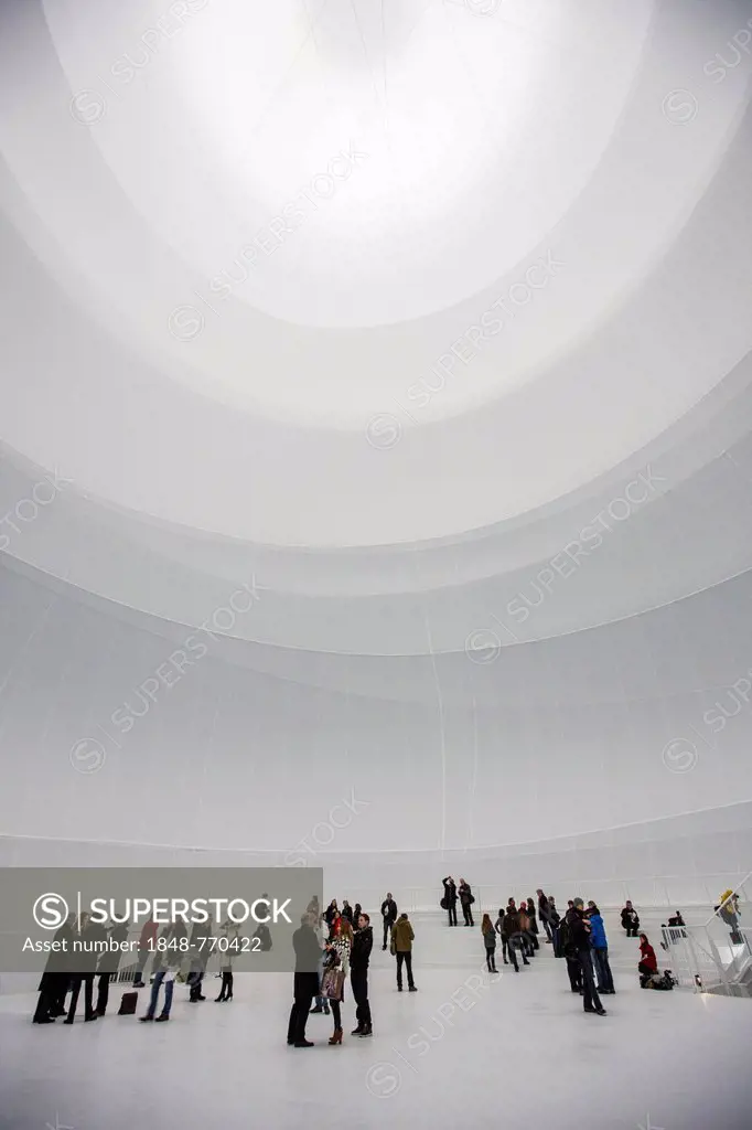Visitors within an installation by Christo, 90 meters high, 50 meters wide, consisting of 20,350 square meters of fabric and 4500 meters of rope, volu...