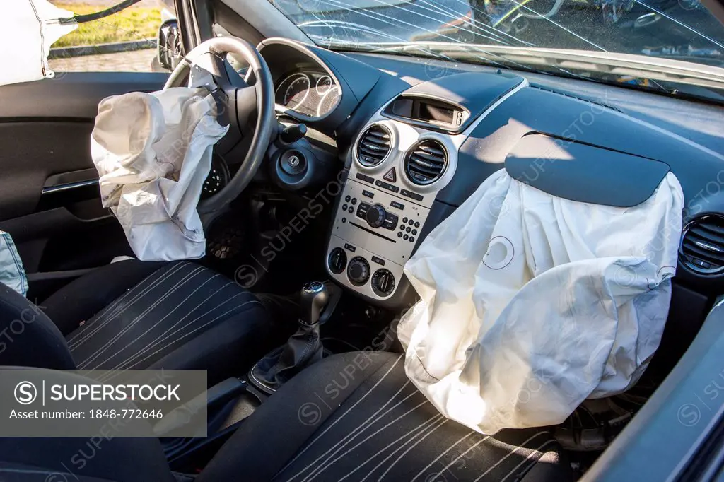 Deployed airbags in a car after a traffic accident