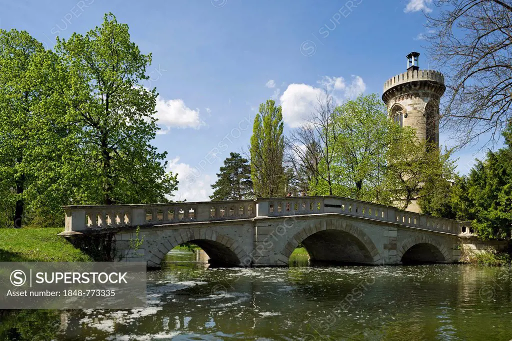 Castle pond with a stone bridge in the gardens of Schlosspark Laxenburg