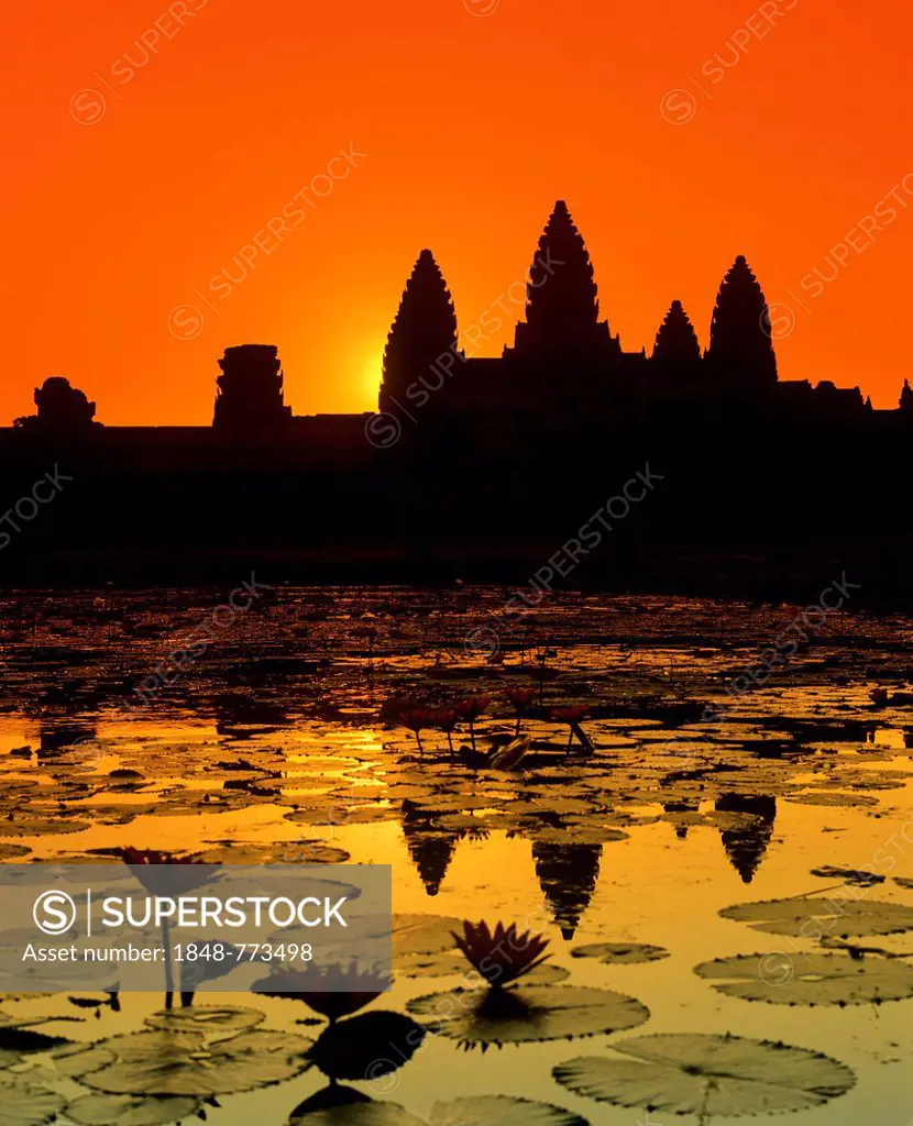 Main temple of Angkor Wat reflected in a lotus pond, silhouette at sunrise, UNESCO World Cultural Heritage Site