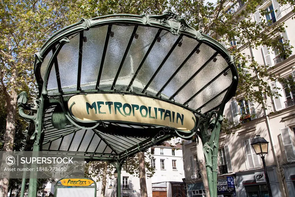 Entrance of the metro station Abbesses with original art nouveau roof