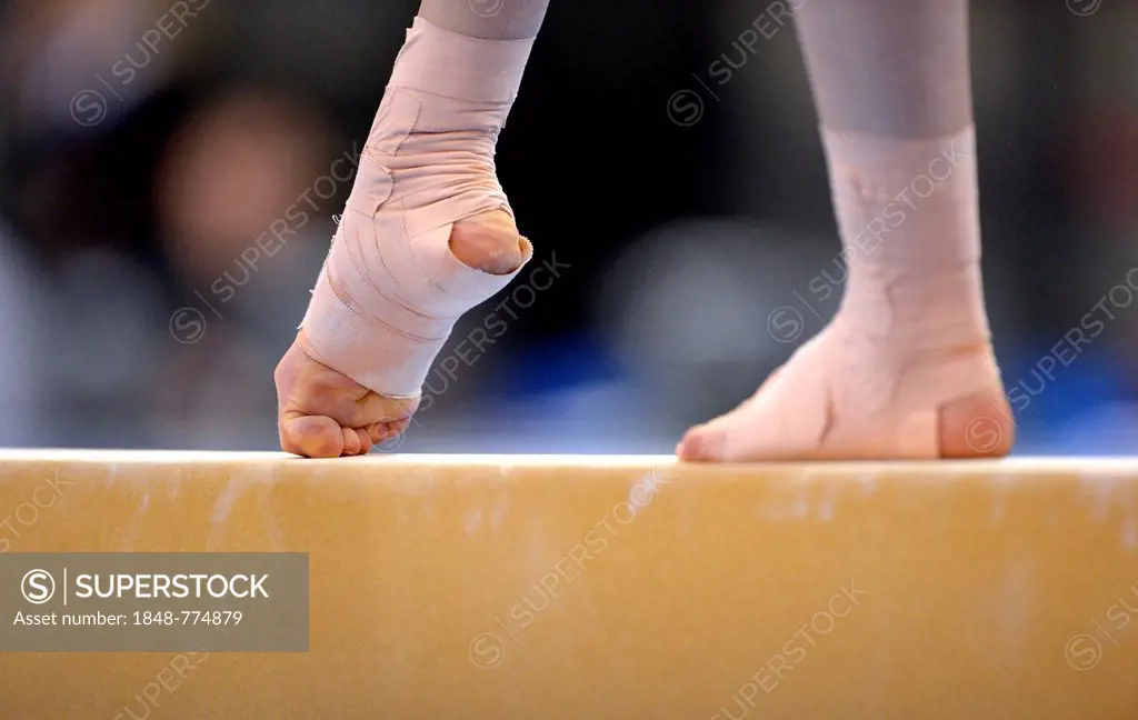 Detail view of a bandaged foot, balance beam, EnBW Gymnastics World Cup 2012, Porsche-Arena