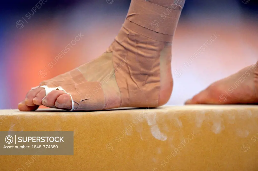 Detail view of a bandaged foot, balance beam, EnBW Gymnastics World Cup 2012, Porsche-Arena