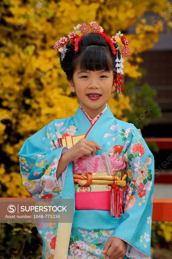 Japanese girl dressed festively for the Shichi-go-san Festival in Shimogamo Shrine
