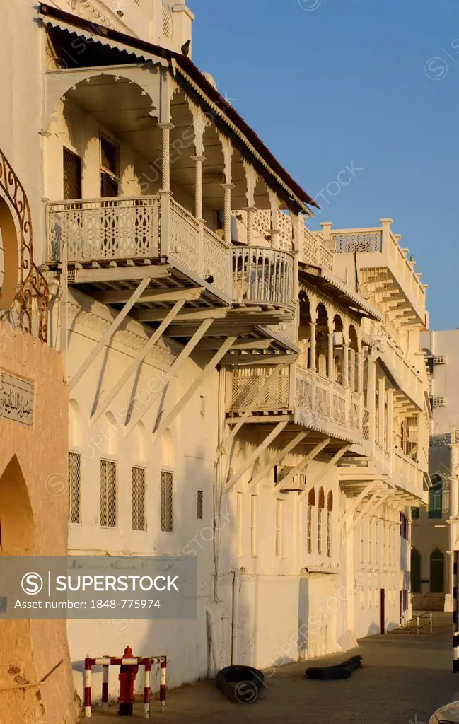 The white wooden merchant houses with their typical balconies