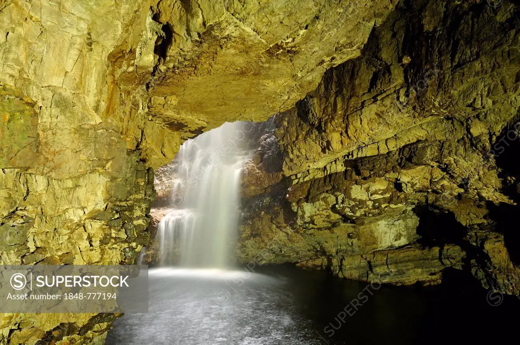Smoo Cave, river flowing down into a limestone cave