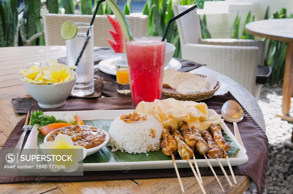 Chicken satay, chicken skewers with rice, Indonesian cuisine, at a restaurant