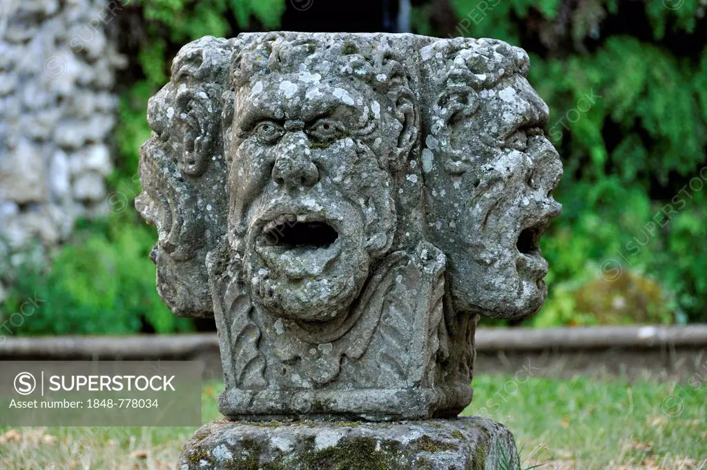 Stone mask with four heads at the grotto of the water source, Fontana del Diluvio, flood fountain, garden of Villa Lante