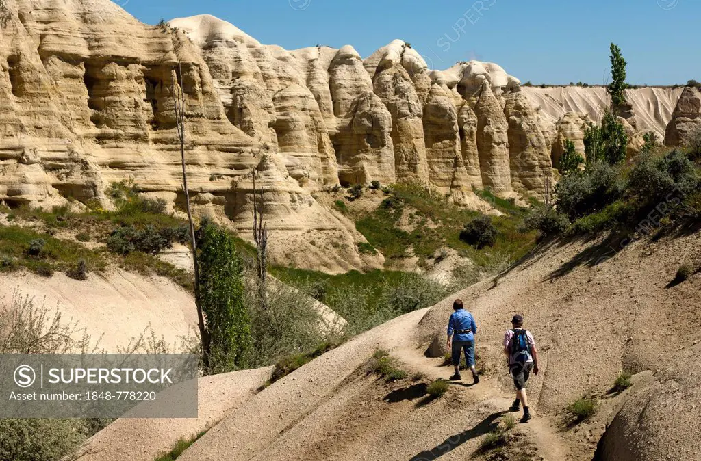 Hikers in Love Valley or Ask Vadisi in a tufa landscape, UNESCO World Heritage Site, Göreme National Park and the Rock Sites of Cappadocia