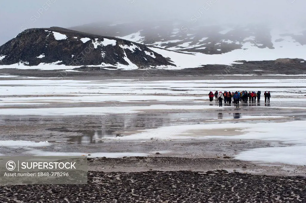 Visitors walking on Phippsøya, one of the northernmost islands of Svalbard at over 80°N