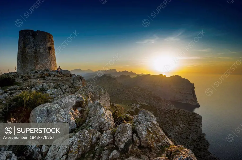 Pirates' Tower or watch tower, mountains and sea, sunset