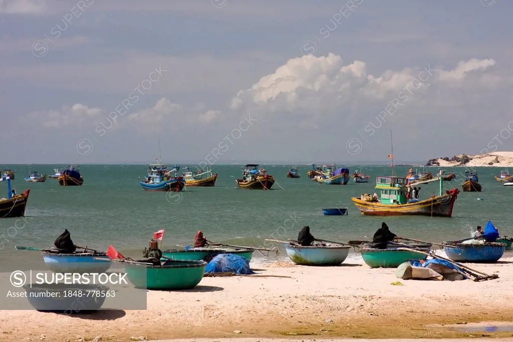 Boats on the beach and on the sea, at a fishing village