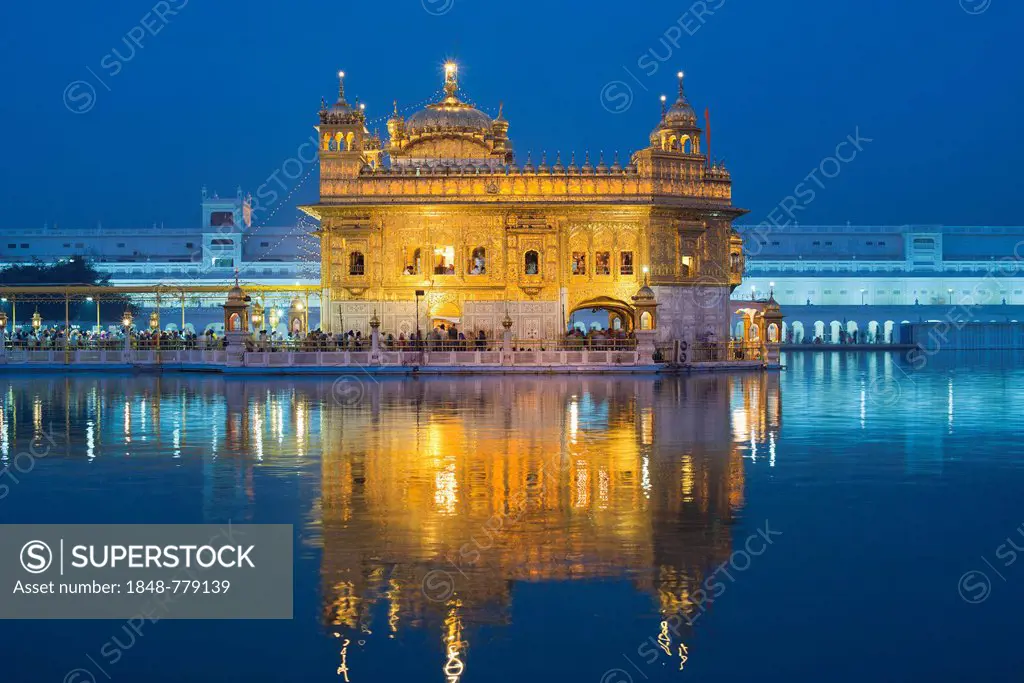 The Harmandir Sahib or Darbar Sahib, Golden Temple, the main shrine of the Sikhs, with the holy Amrit Sagar lake at dusk
