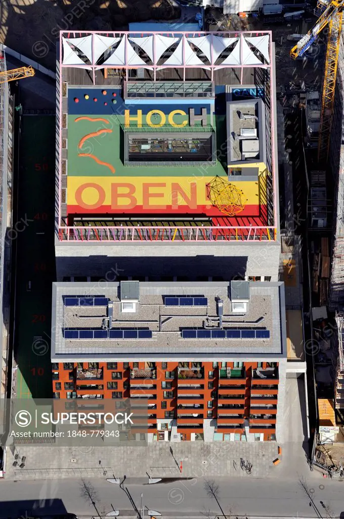 Aerial view, message Ganz hoch oben, German for very high up, on the roof of Katharinenschule primary school, daycare, and children's hotel, at Dalman...