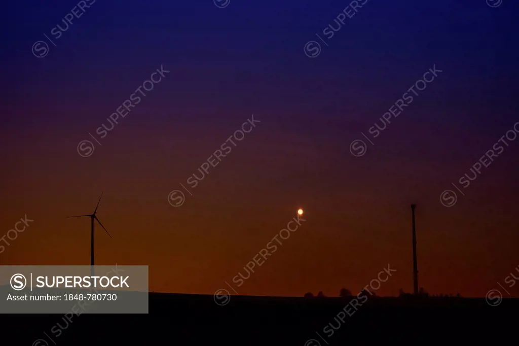 Wind turbines at full moon