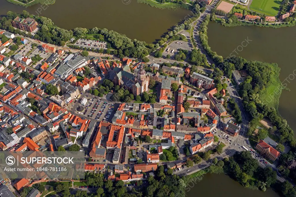 Aerial view, old town island surrounded by water at the sound of Strelasund, St. Nikolai church