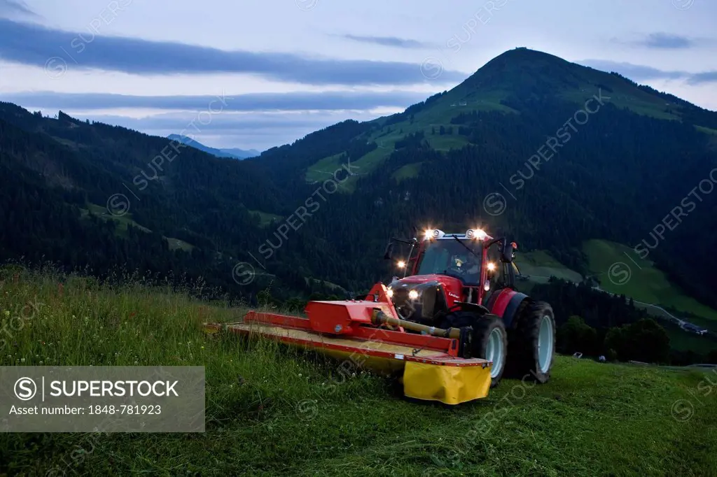 Tractor mowing hay