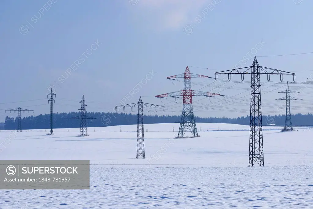 Pylons in a snow-covered winter landscape