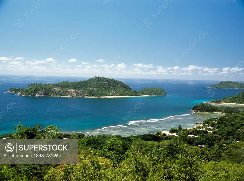 View from a hill on Mahe Island towards an island off the coast