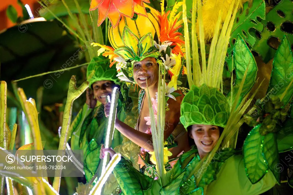 Dancers in colourful costumes on floats, parade of the Academicos do Grande Rio samba school during the Carnival in Rio de Janeiro in 2013