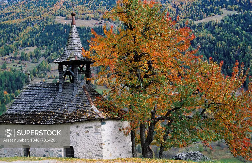 Chapel of Grimentz with trees in autumn