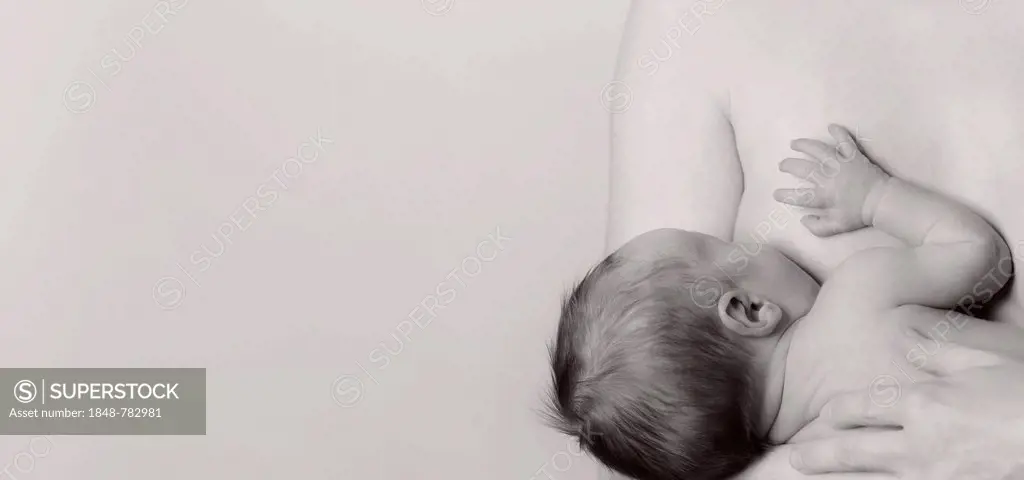Woman breastfeeding a boy, two weeks, infant, baby