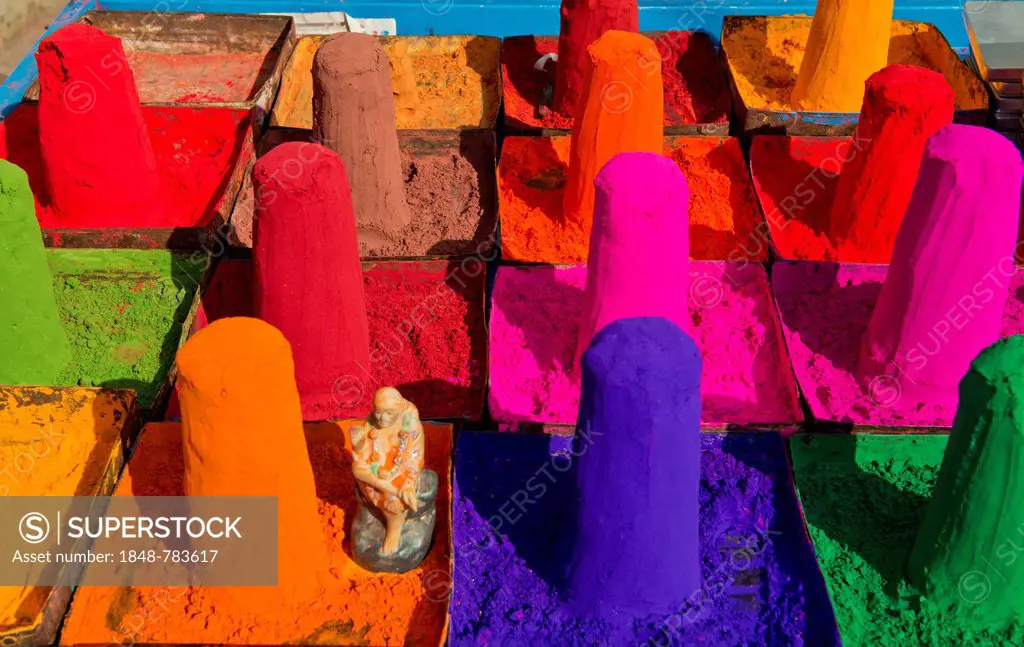 Colour powder for ritual purposes is displayed in small turrets for sale