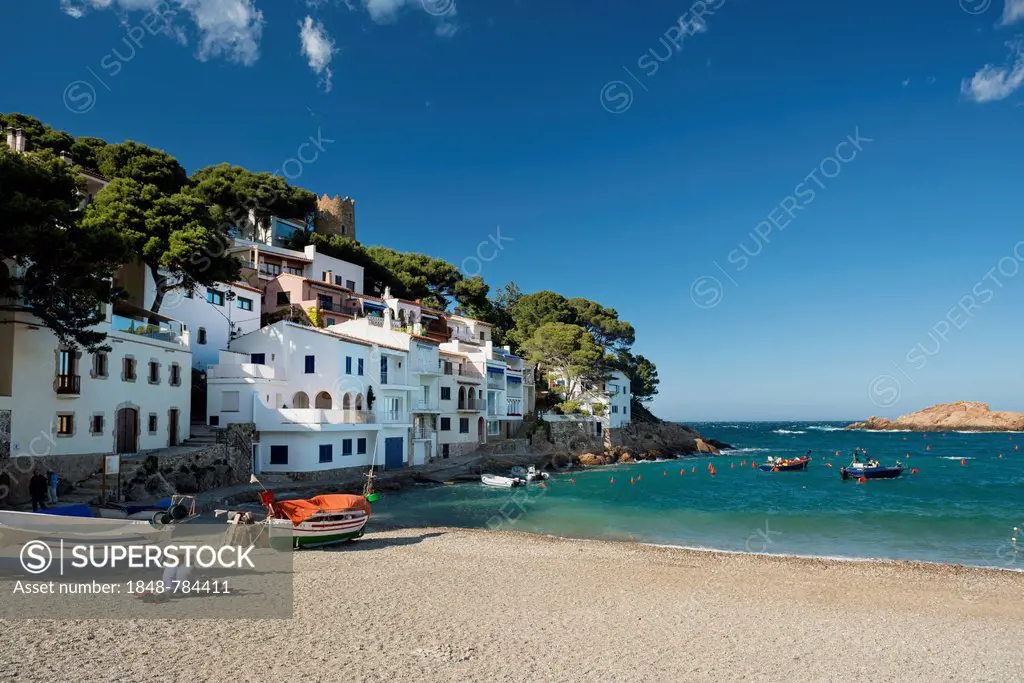 Houses and fishing boats by the sea