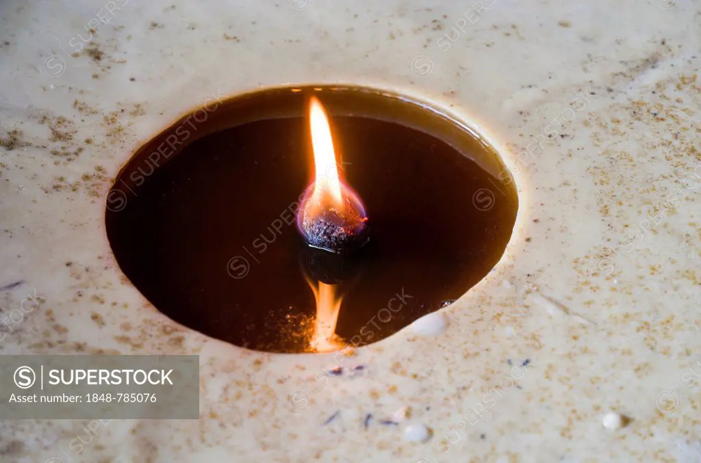 Flame burning inside a big butterlamp
