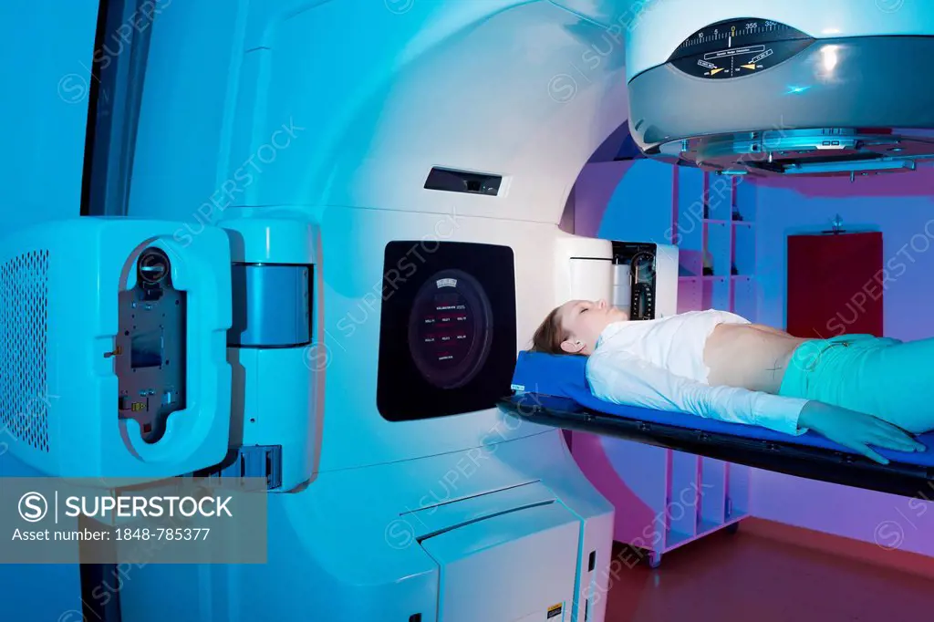 Patient lying in a linear particle accelerator for radiation treatment